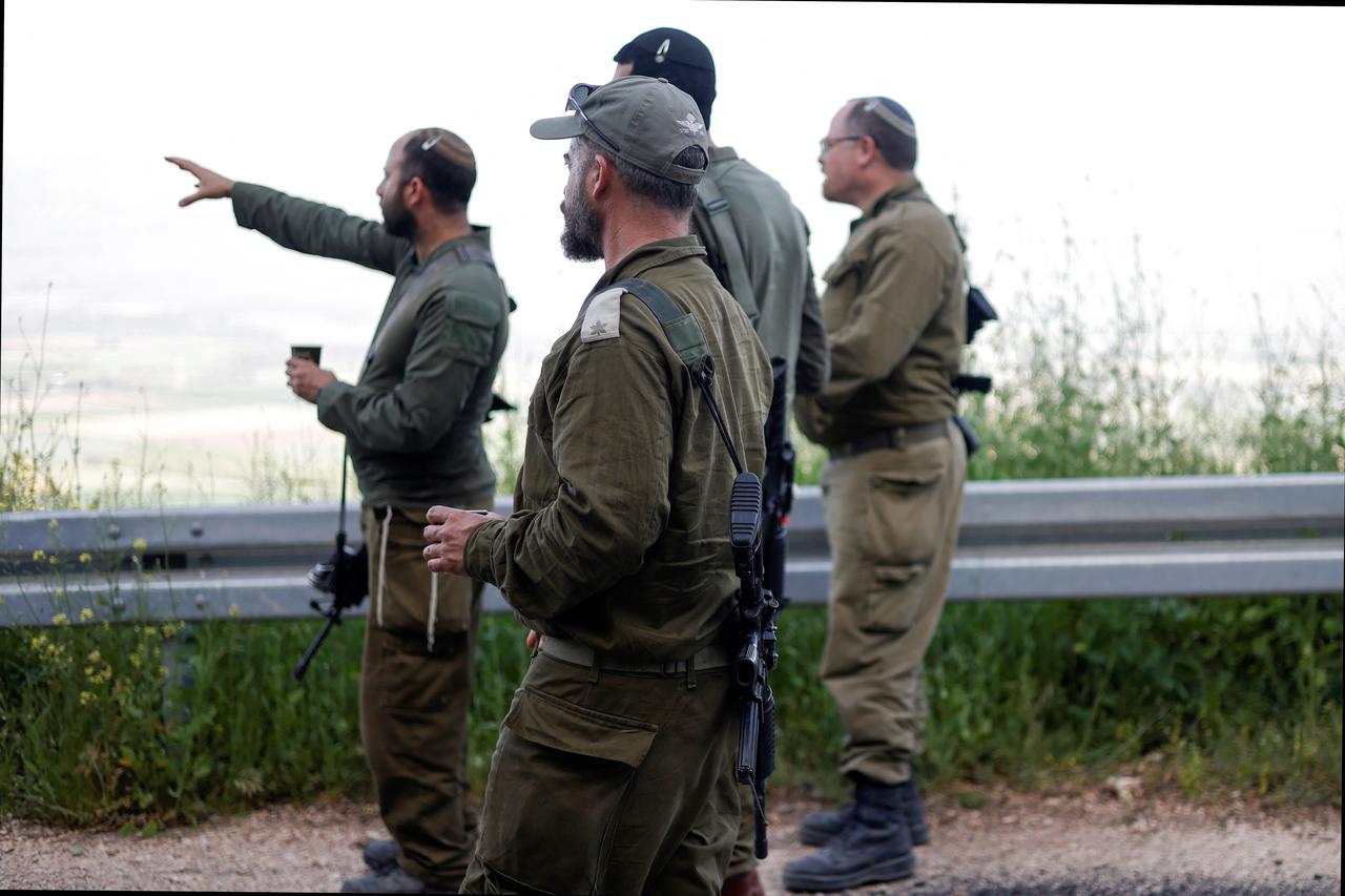 Israeli soldiers patrol along the Israel-Lebanon border, April 16, 2026. (AFP Photo)