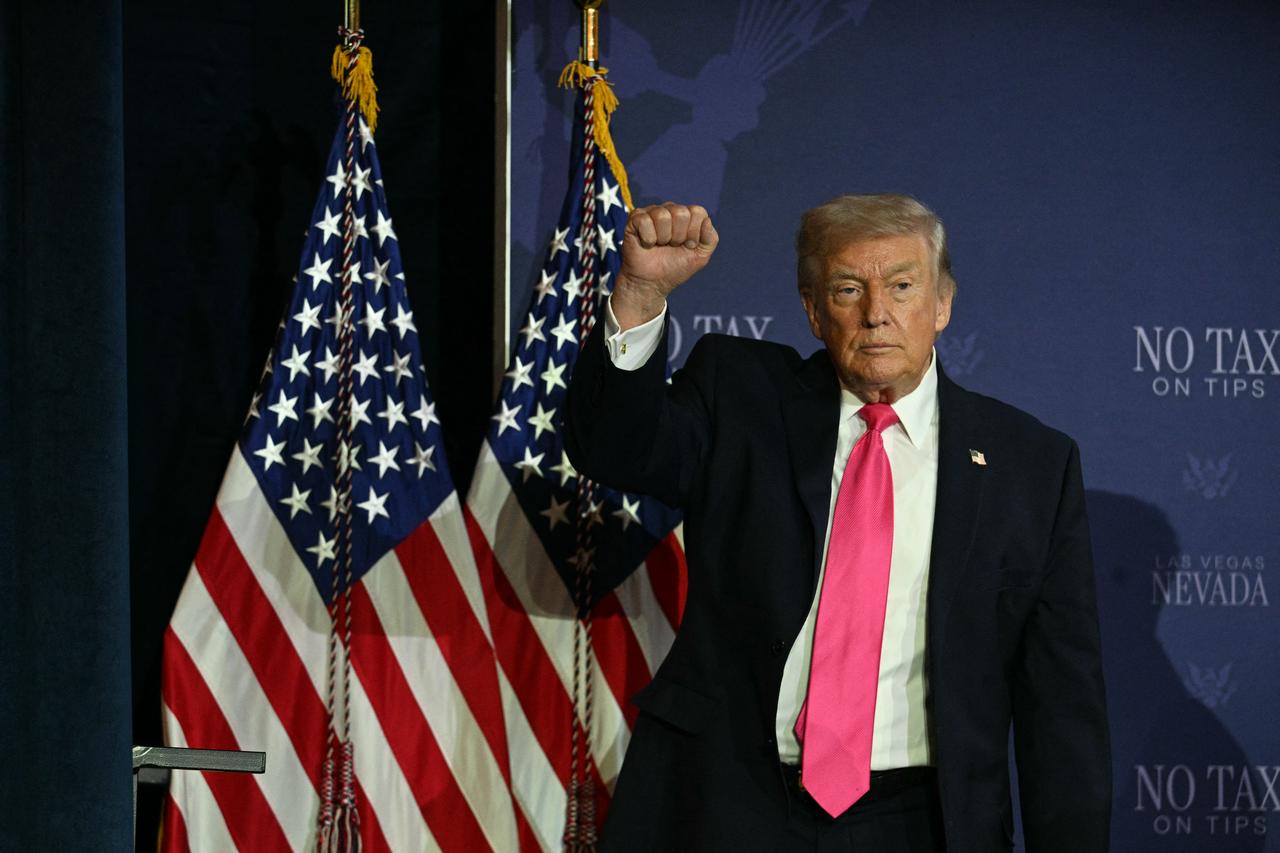 US President Donald Trump (R) makes a fist after a roundtable discussion on his "no tax on tips" policy at the AC Hotel Las Vegas Symphony Park in Las Vegas, Nevada, April 16, 2026. (AFP Photo)