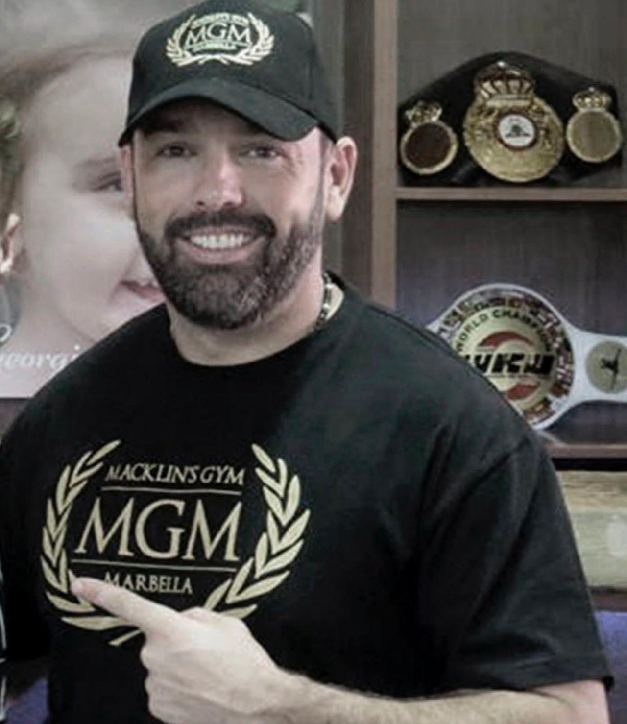 Daniel Kinahan poses in front of boxing memorabilia. (Photo via X/@OnTheRecordBox)