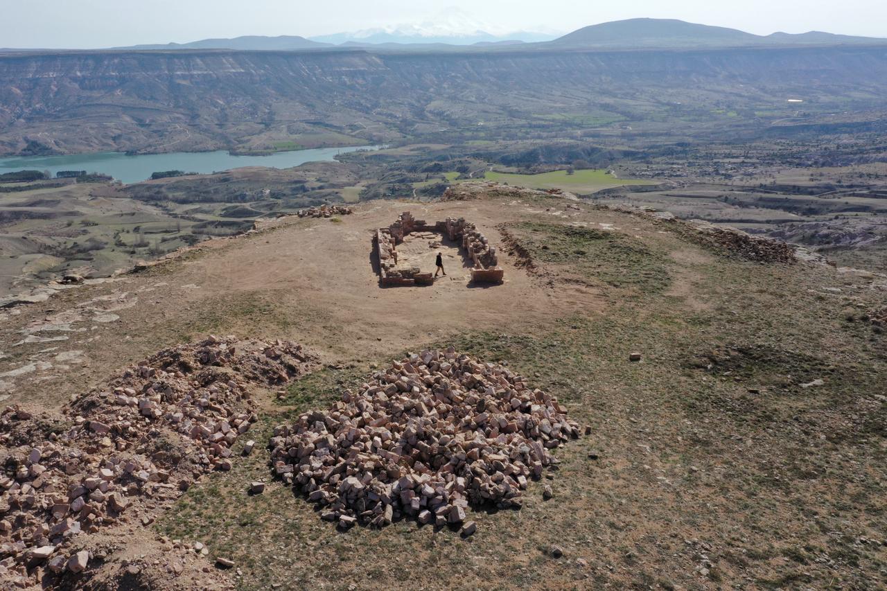 An aerial view shows the remains of a church structure atop Meryem Ana Mountain overlooking the surrounding landscape between Damsa Dam and nearby villages in Cappadocia, Nevsehir, Türkiye. (AA Photo)