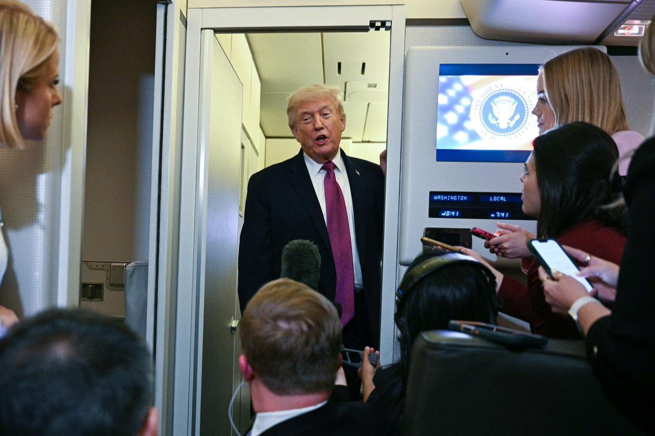 US President Donald Trump speaks to the press aboard Air Force One before arriving at Joint Base Andrews in Maryland on April 17, 2026. (AFP Photo)