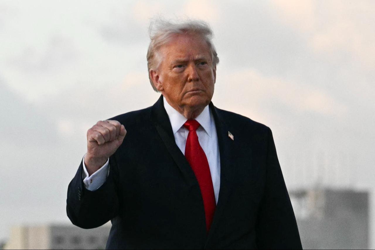 US President Donald Trump makes a fist upon arrival at Miami International Airport in Miami, US, on April 11, 2026. (AFP Photo)