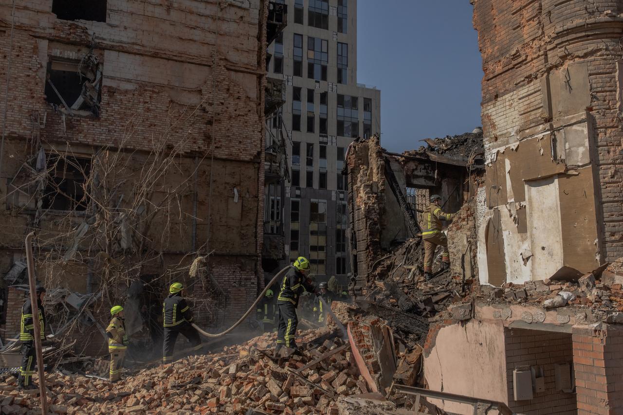 Ukrainian rescuers work at the site of heavily damaged buildings following a Russian air attack in Dnipro, on April 16, 2026. (AFP Photo)