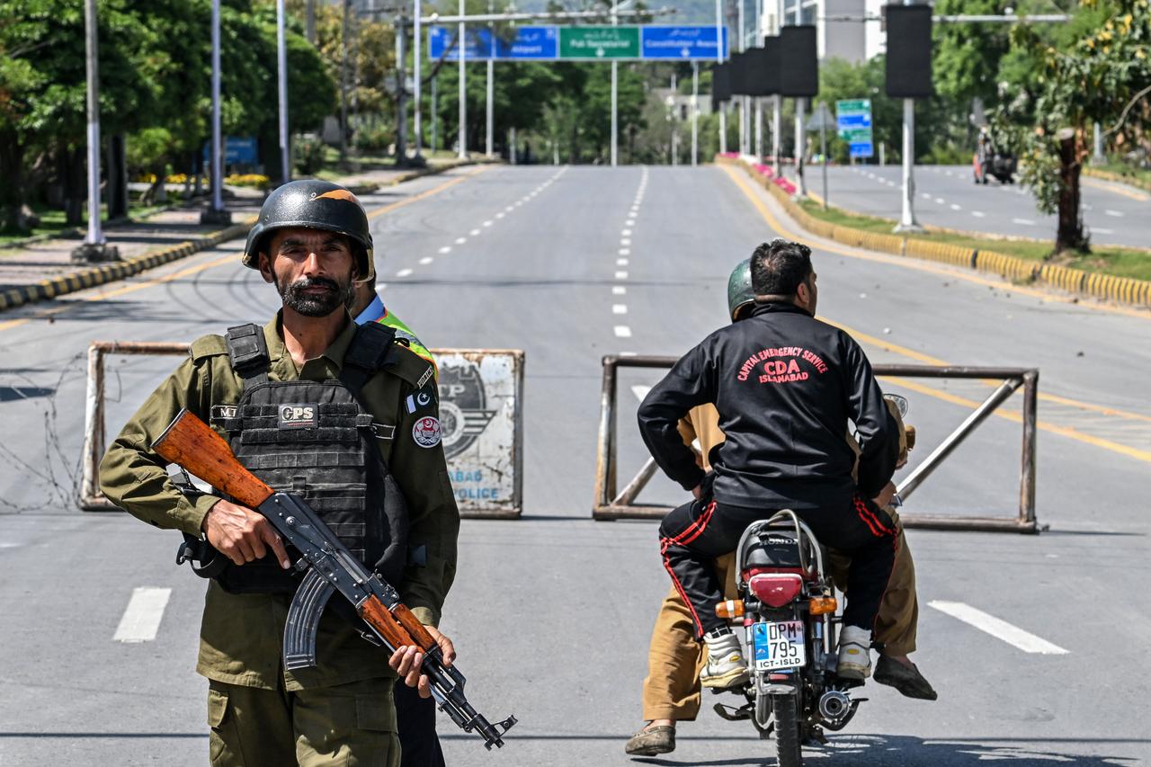 A member of the police stands guard at a closed road leading to the Serena Hotel in the Red Zone area of Islamabad, April 19, 2026. (AFP Photo)