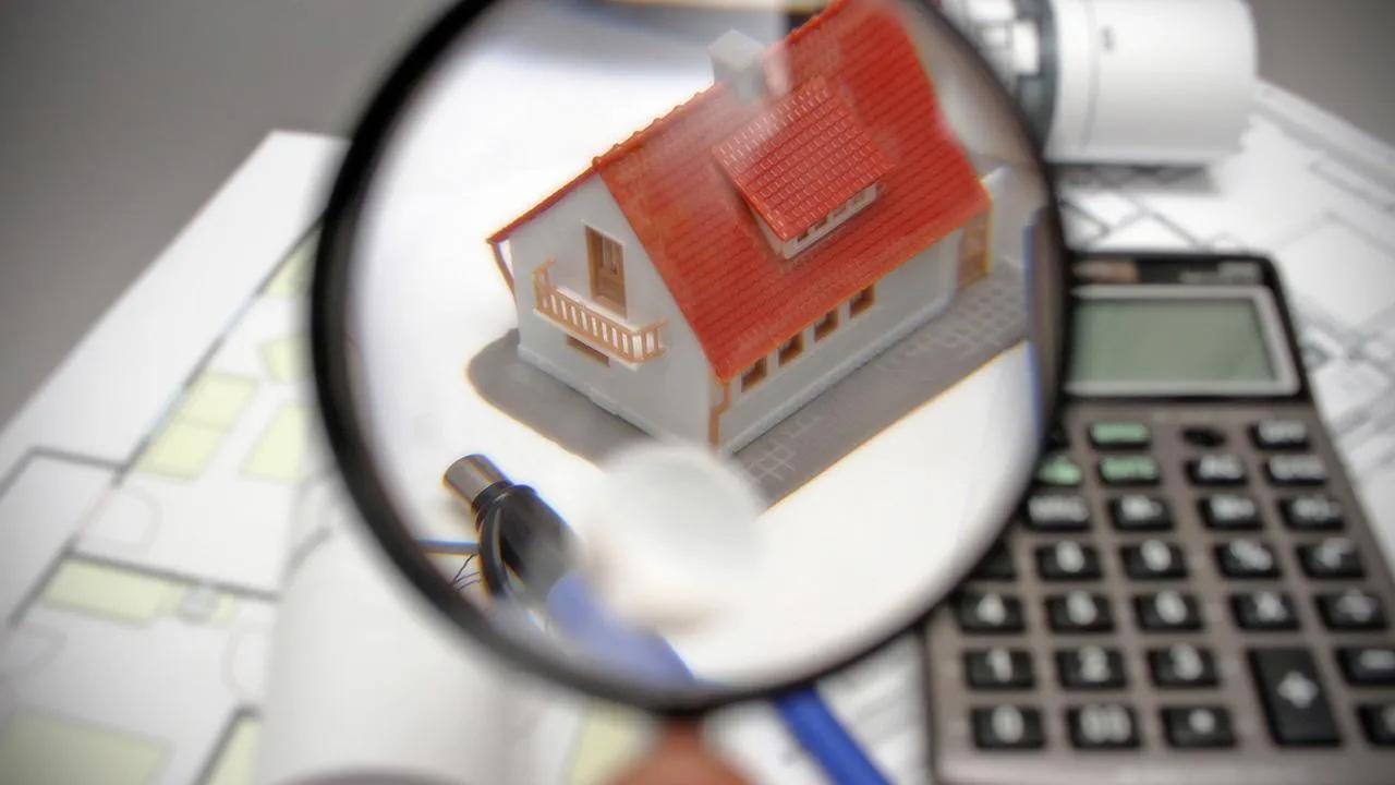 A model house is examined with a magnifying glass alongside documents and a calculator in an unspecified location, undated. (Photo via Türkiye Gazetesi)