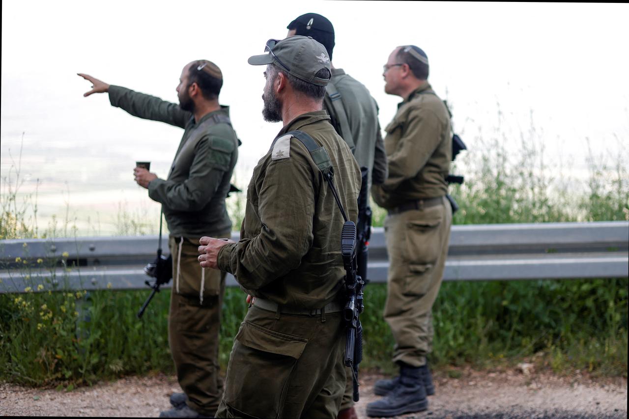 Israeli soldiers patrol along the Israel-Lebanon border on April 16, 2026. (AFP Photo)