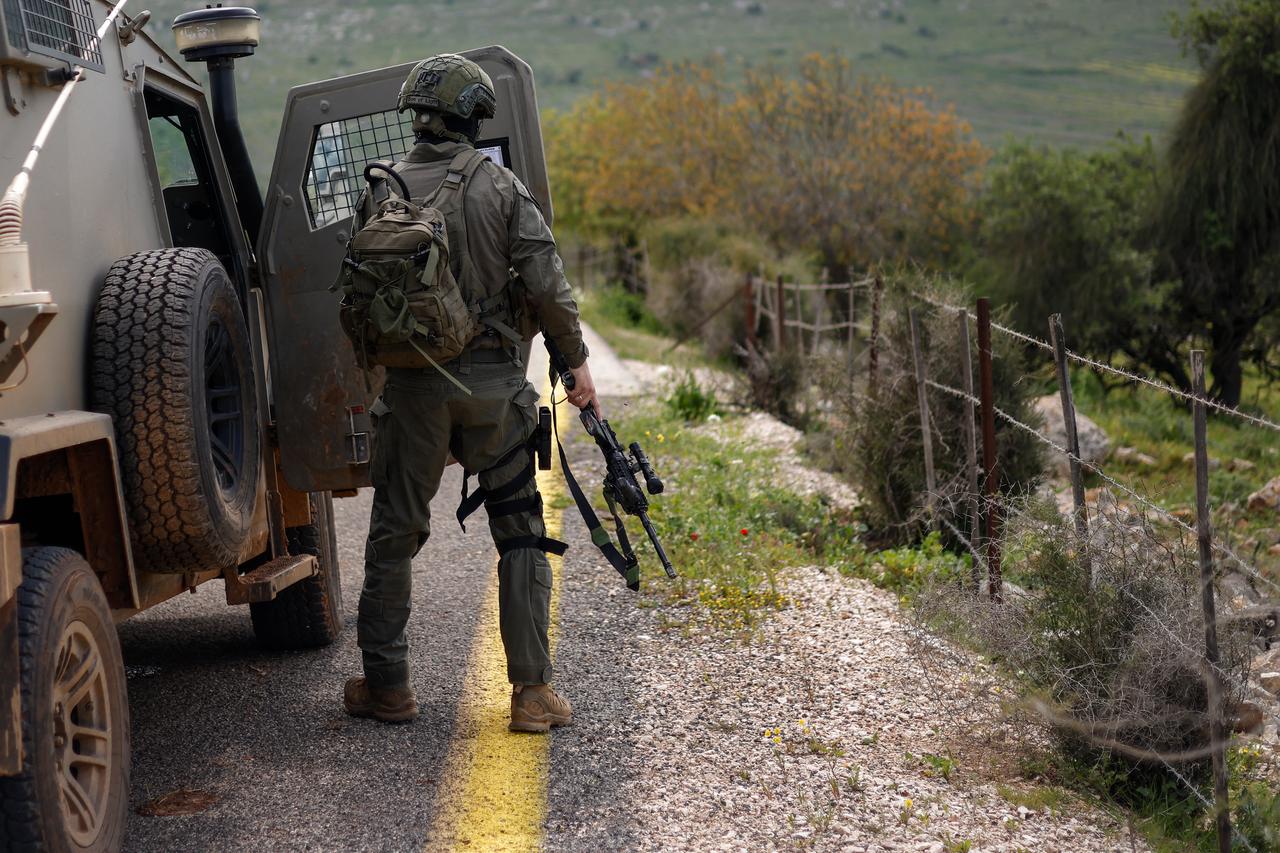 An Israeli soldier patrols along the Israel-Lebanon border on April 10, 2026. (AFP Photo)