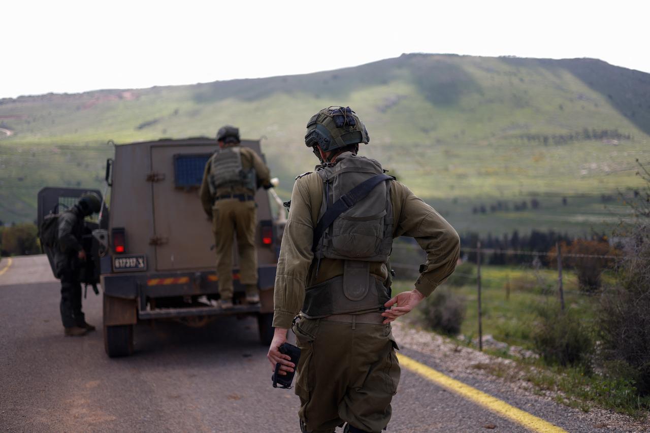 Israeli soldiers patrol along the Israel-Lebanon border on April 10, 2026. (AFP Photo)