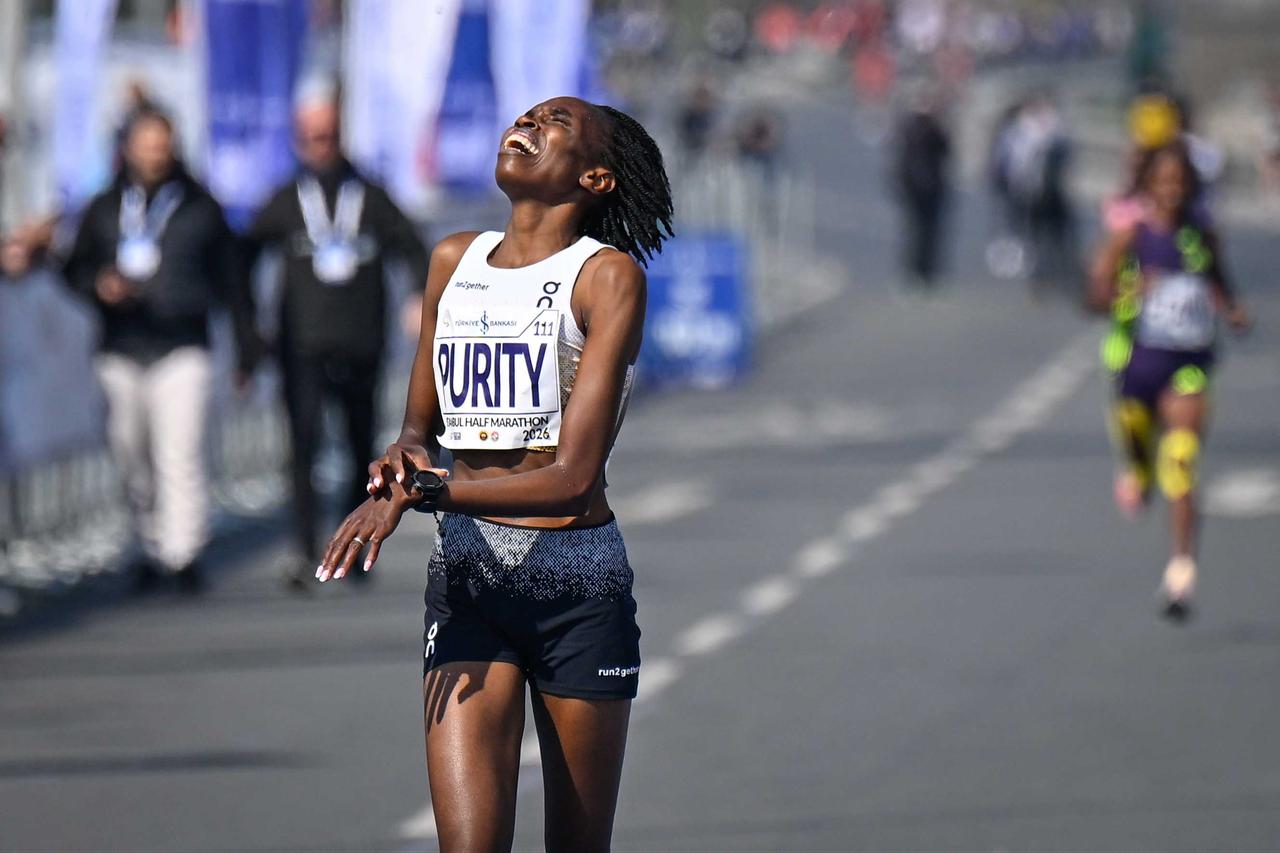 Kenya’s Purity Gitonga crosses the finish line to claim victory in the women’s elite race at the 21st Istanbul Half Marathon, held in Istanbul’s Historic Peninsula, Türkiye, April 19, 2026. (AA Photo)