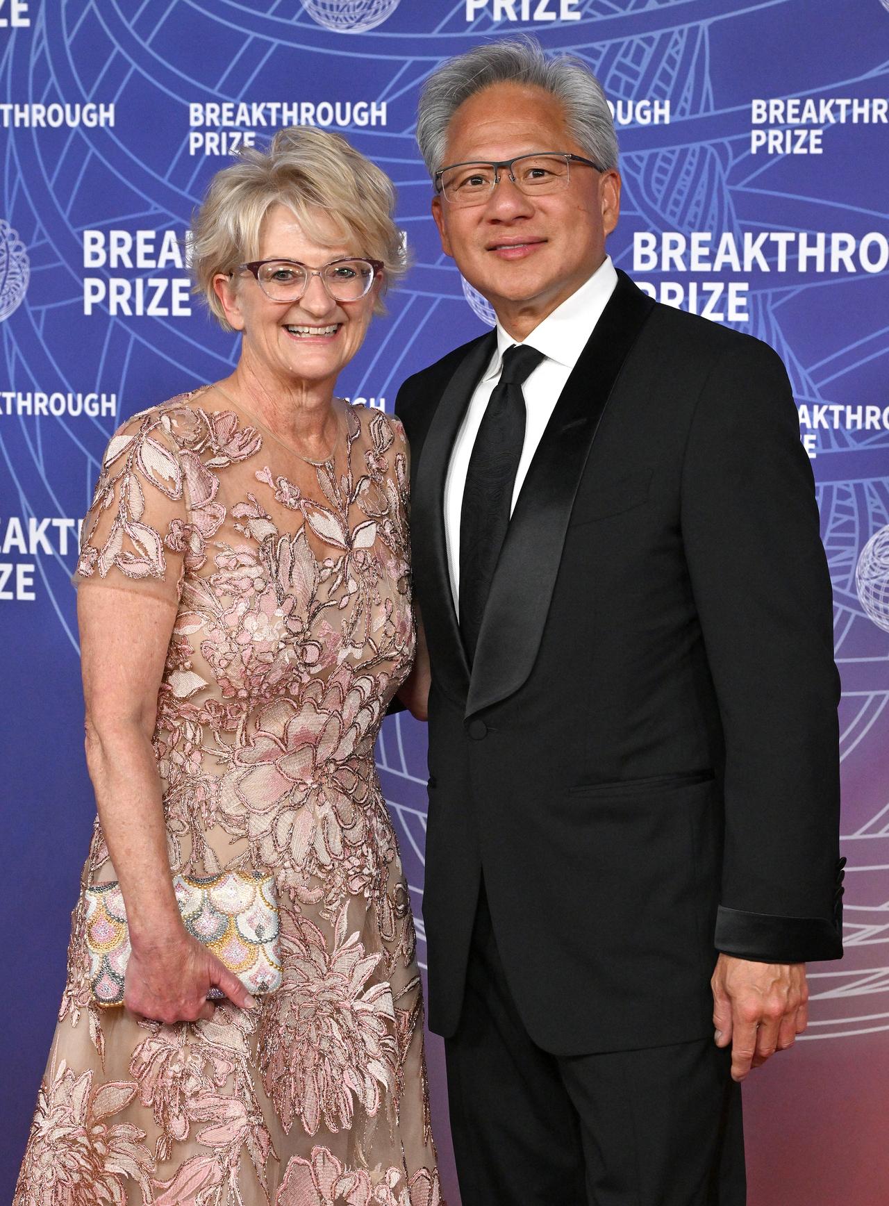 Nvidia CEO and President Jensen Huang and his wife Lori Huang attend the 12th Breakthrough Prize Ceremony at Barker Hangar in Santa Monica, California, April 18, 2026. (AFP Photo)