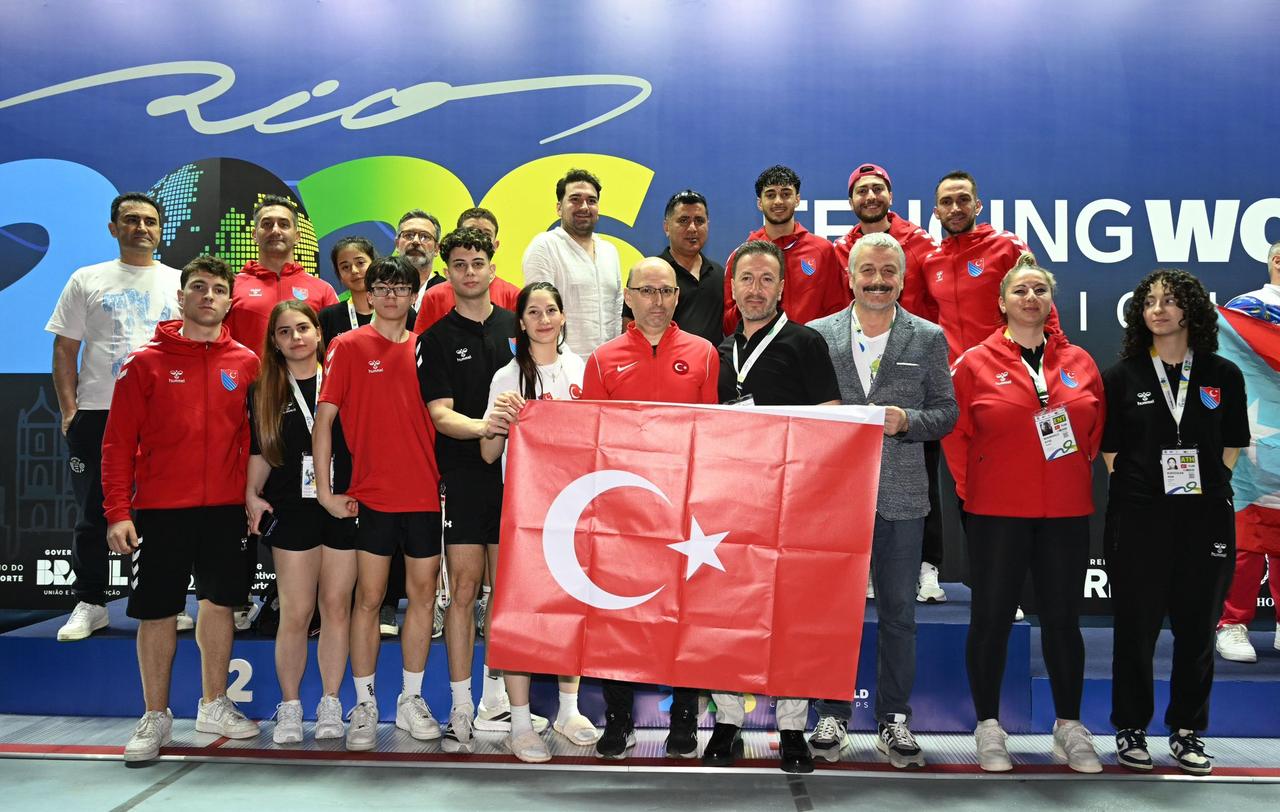 Members of the Turkish fencing team and officials pose with the Turkish flag after Furkan Yaman won the junior men’s sabre title at the Cadet & Junior World Championships in Rio de Janeiro, Brazil. (Photo via X / @TurkiyeEskrimF)