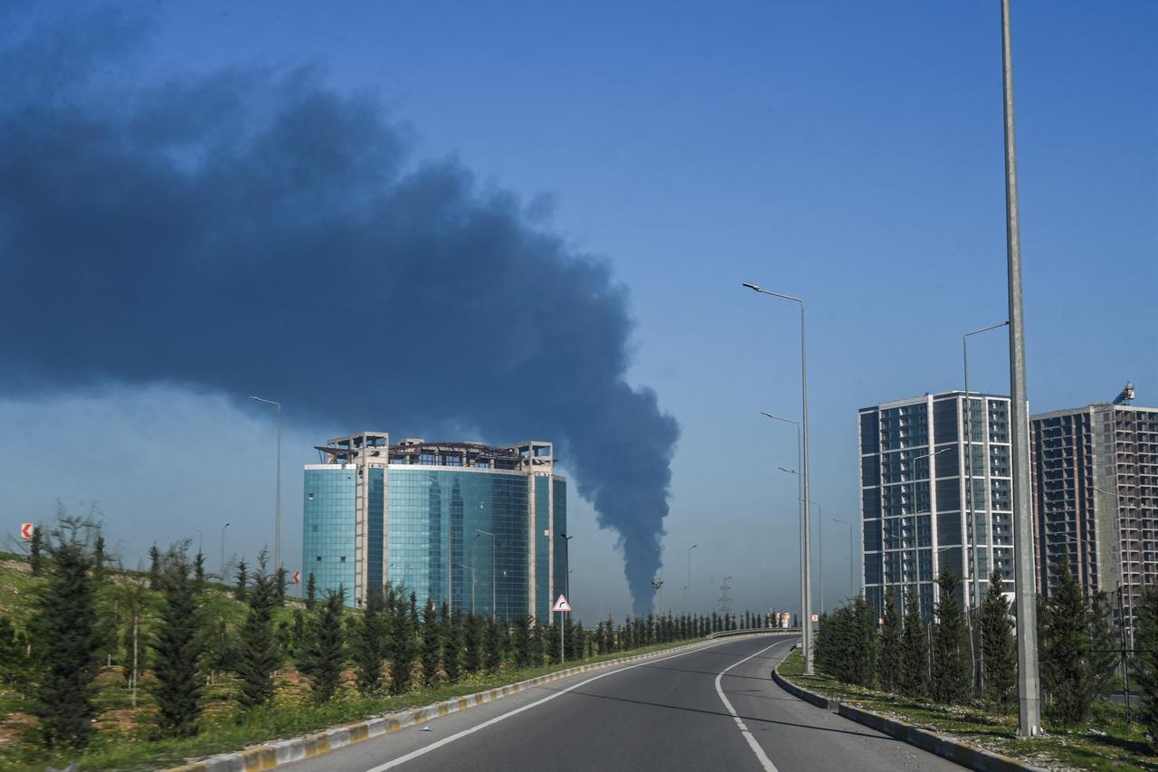 Smoke billows from an oil warehouse in the Kani Qirzhala area on the outskirts of Erbil, following a suspected drone strike, on April 1, 2026. (AFP Photo)