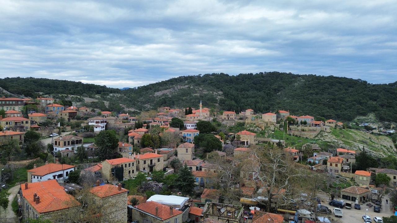 A general view of restored stone houses with red-tiled roofs in Adatepe village, Canakkale, Türkiye. (AA Photo)