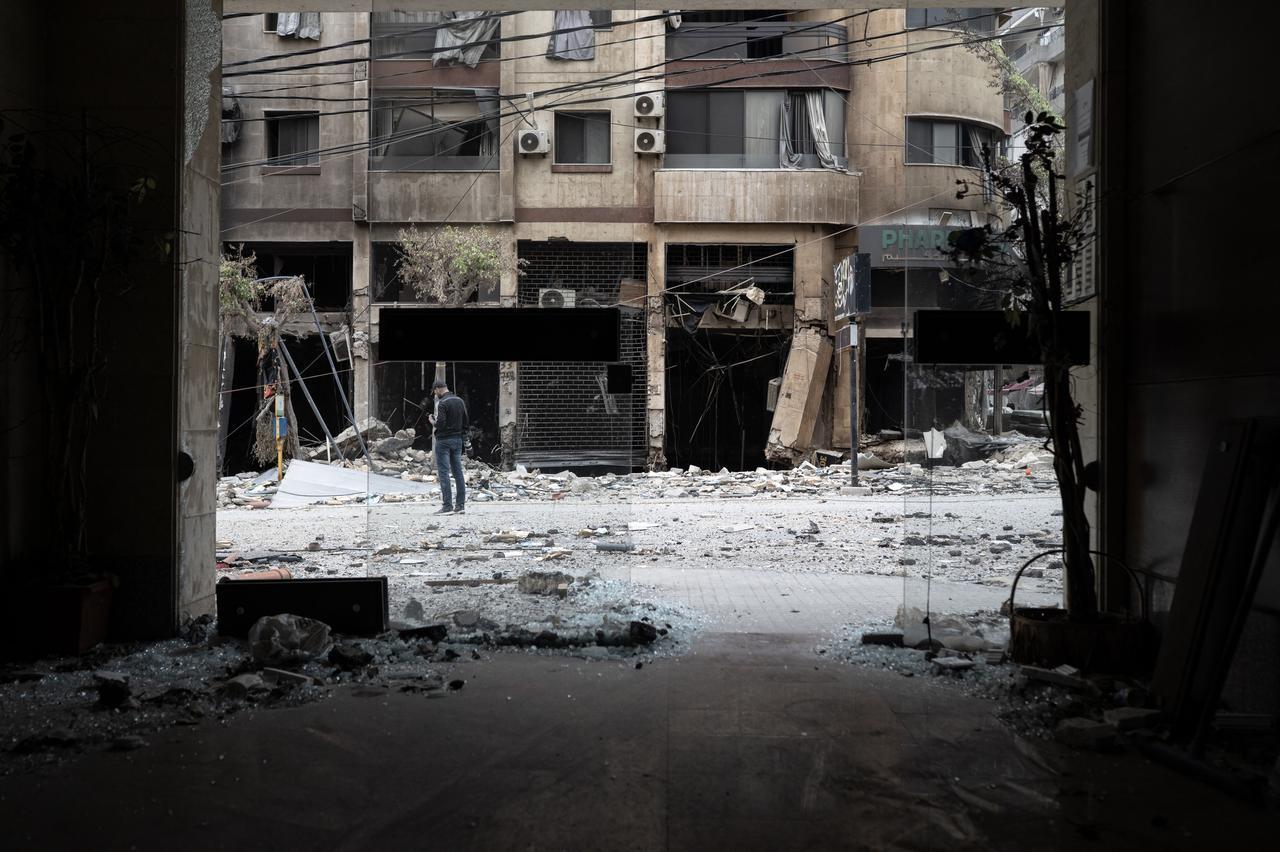 Lebanese people walk among the rubble of destroyed buildings as they begin returning to their homes following the implementation of the ceasefire in Beirut, Lebanon, April 20, 2026. (AA Photo)