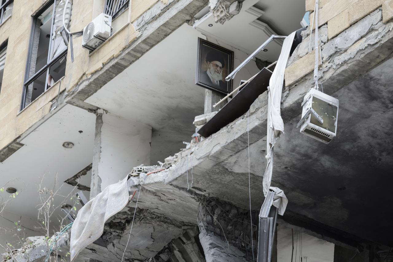 A portrait of Iran's slain supreme leader Ali Khamenei hangs on the wall of a damaged apartment during a media tour in the Haret Hreik area of Beirut’s southern suburbs, April 20, 2026. (AFP Photo)