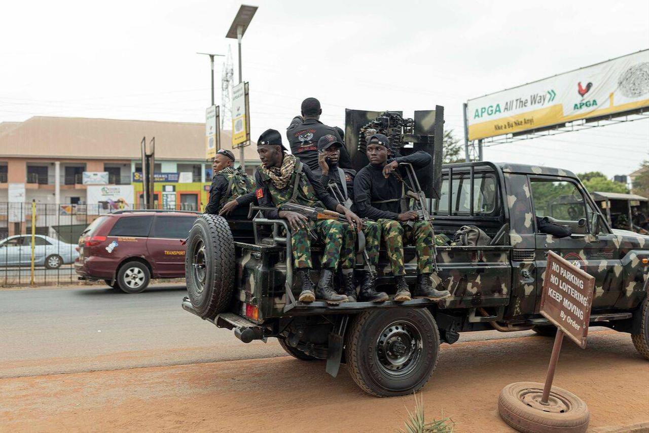 Armed Nigerian army officers sit inside a military vehicle parked outside the Central Bank of Nigeria (CBN) in Awka, Nigeria, on February 24, 2023. (AFP Photo)