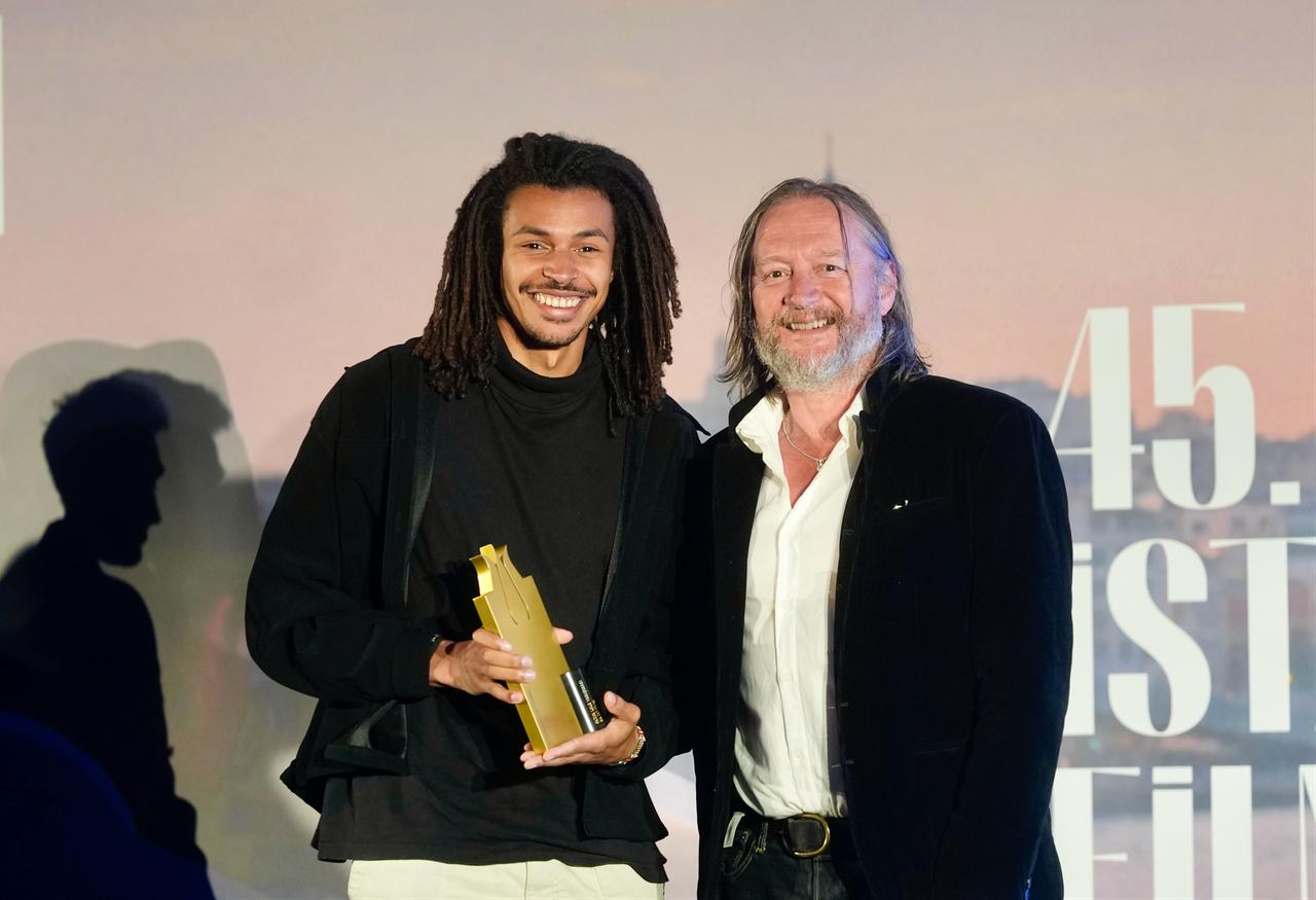 David Mackenzie and Damien Hauser pose together after Princess Mumbi receives the Golden Tulip at the 45th Istanbul Film Festival in Istanbul, Türkiye. (AA Photo)