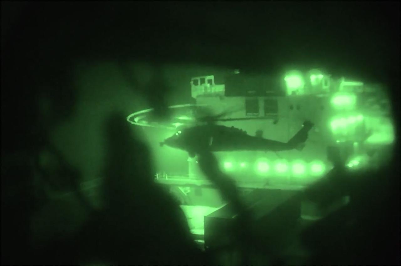 This screen grab, obtained from a video released by the US Central Command on April 20, 2026, shows US Marines boarding and seizing the Iranian-flagged vessel M/V Touska. (Photo by US Central Command Public Affairs/AFP)