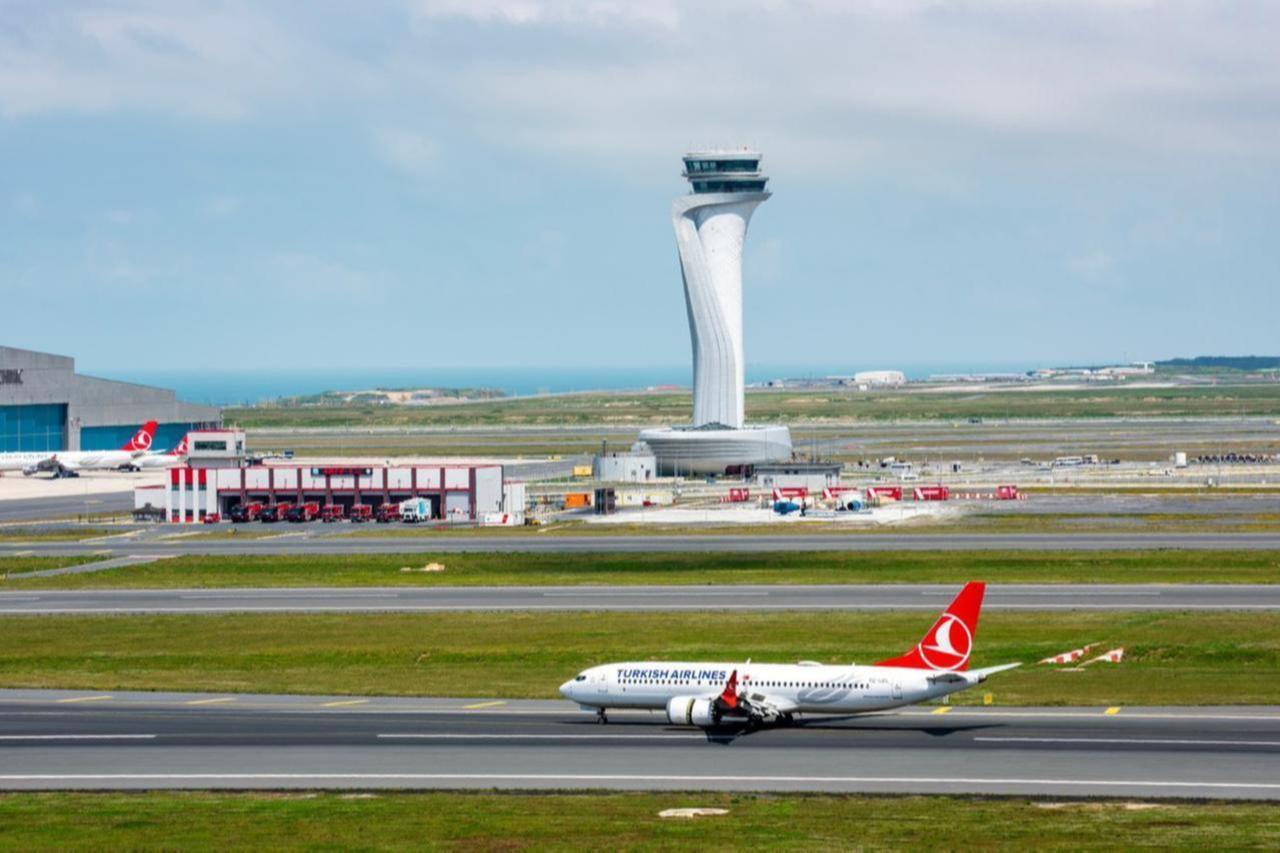 Turkish Airlines airplane with Air Traffic Control Tower of Istanbul Airport in Istanbul, Türkiye on June 3, 2023. (Adobe Stock Photo)