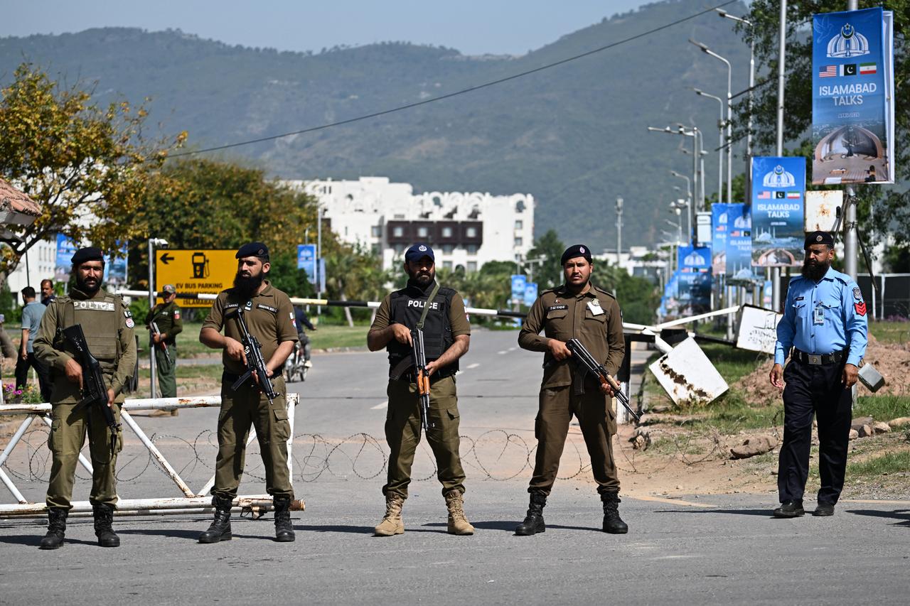 Security personnel stand guard at a security checkpost along a road temporarily closed near the Serena Hotel at the Red Zone area in Islamabad, Pakistan on April 20, 2026. (AFP Photo)