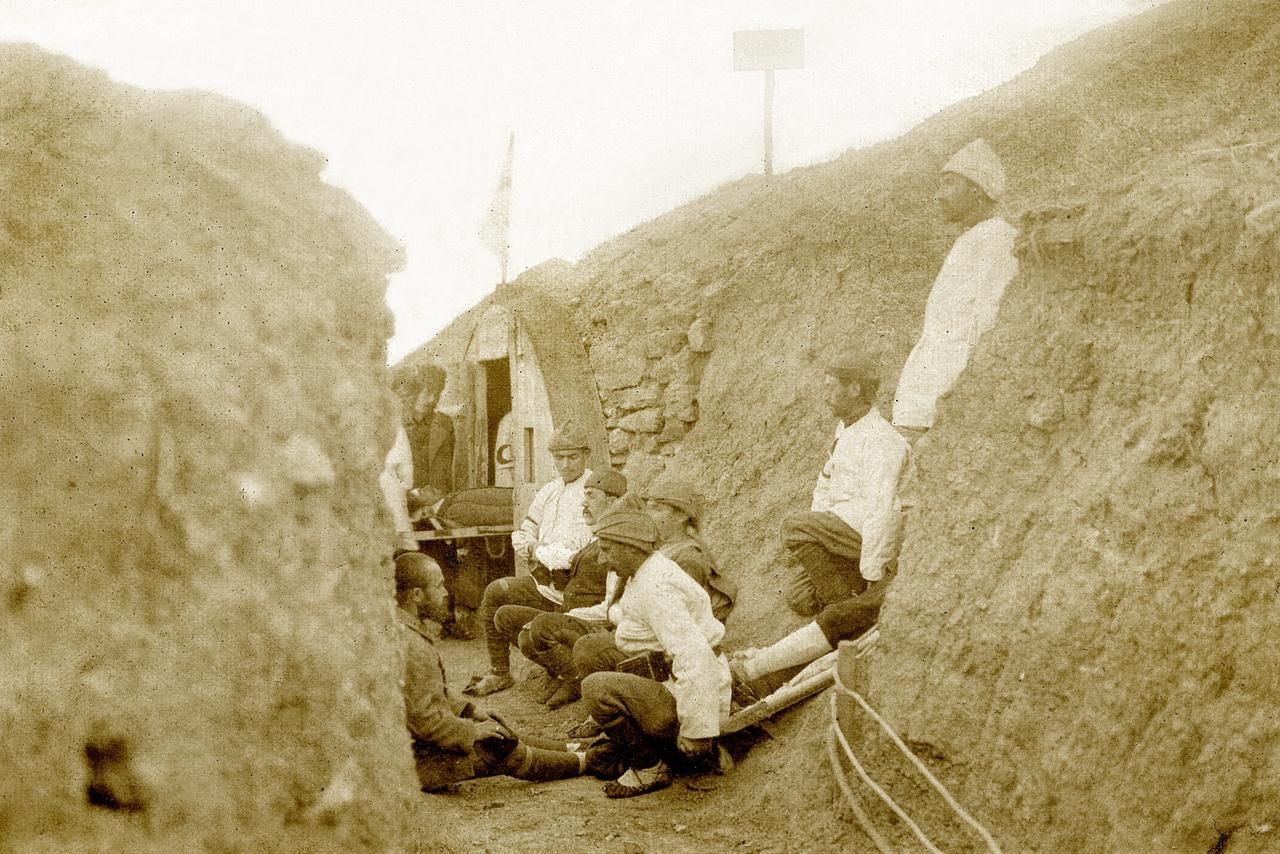 Wounded Ottoman soldiers receive treatment inside a trench-side medical station during intense fighting at Gallipoli, 1915. (AA Photo)