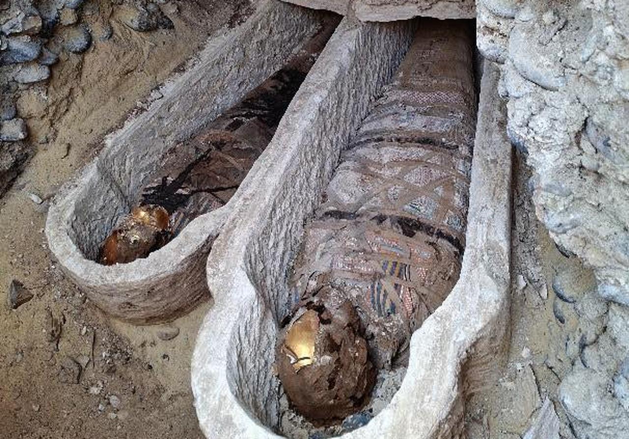 Roman-era mummies placed inside stone sarcophagi, discovered during excavations in Oxyrhynchus, Egypt, April 18, 2026. (Photo via Ministry of Tourism and Antiquities)
