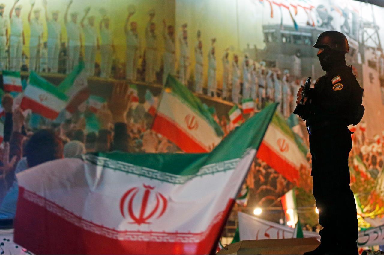 Crowds gather in Enghelab Square, to mark Islamic Republic Day and show support for the government, waving Iranian flags and chanting slogans in Tehran, Iran, on March 31, 2026. (AA Photo)