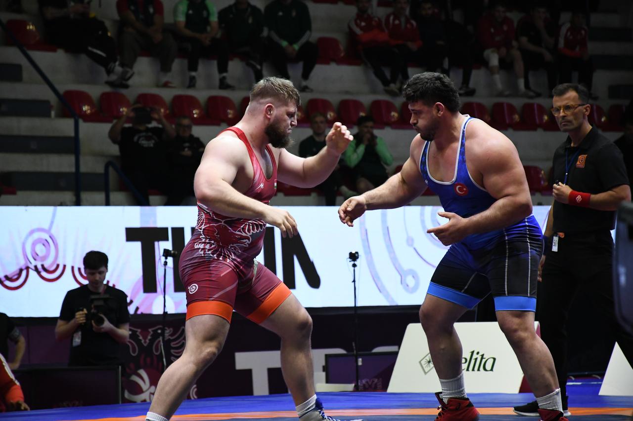 Riza Kayaalp of Turkiye competes against Darius Attila Vitek of Hungary during the 2026 European Wrestling Championships at the 'Feti Borova' Sports Hall in the Tirana Olympic Park, Albania, on April 21, 2026. (AA Photo)