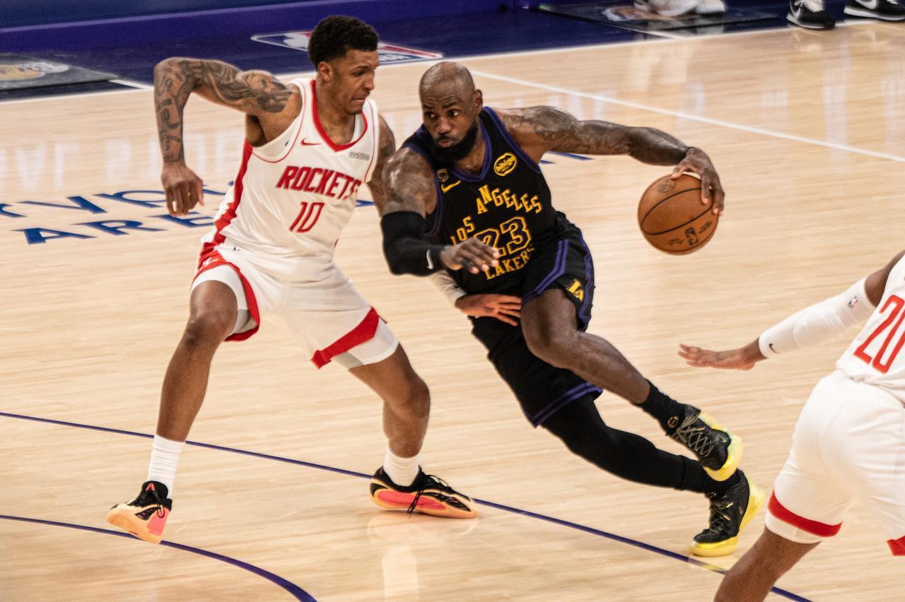 Lebron James (23) of the Los Angeles Lakers drives the ball past Jabari Smith Jr. (10) of the Houston Rockets, Los Angeles, United States, April 21, 2026. (AA Photo)