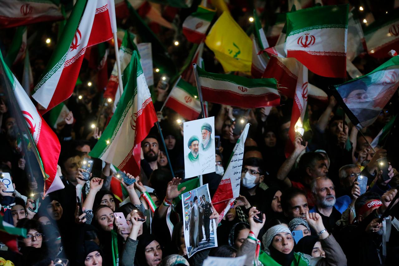 People gather at Enghelab and Vanak squares to participate in anti-US and anti-Israel demonstrations, waving Iranian flags and chanting slogans on April 21, 2026 in Tehran, Iran. (AA Photo)
