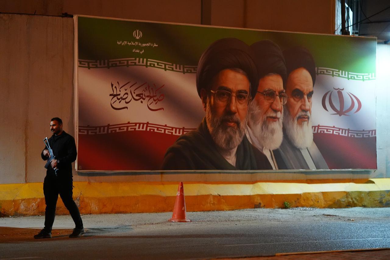 People gather in front of the Iranian Embassy to celebrate the temporary ceasefire between the U.S. and Iran in Baghdad, Iraq, on April 8, 2026. (AA Photo)