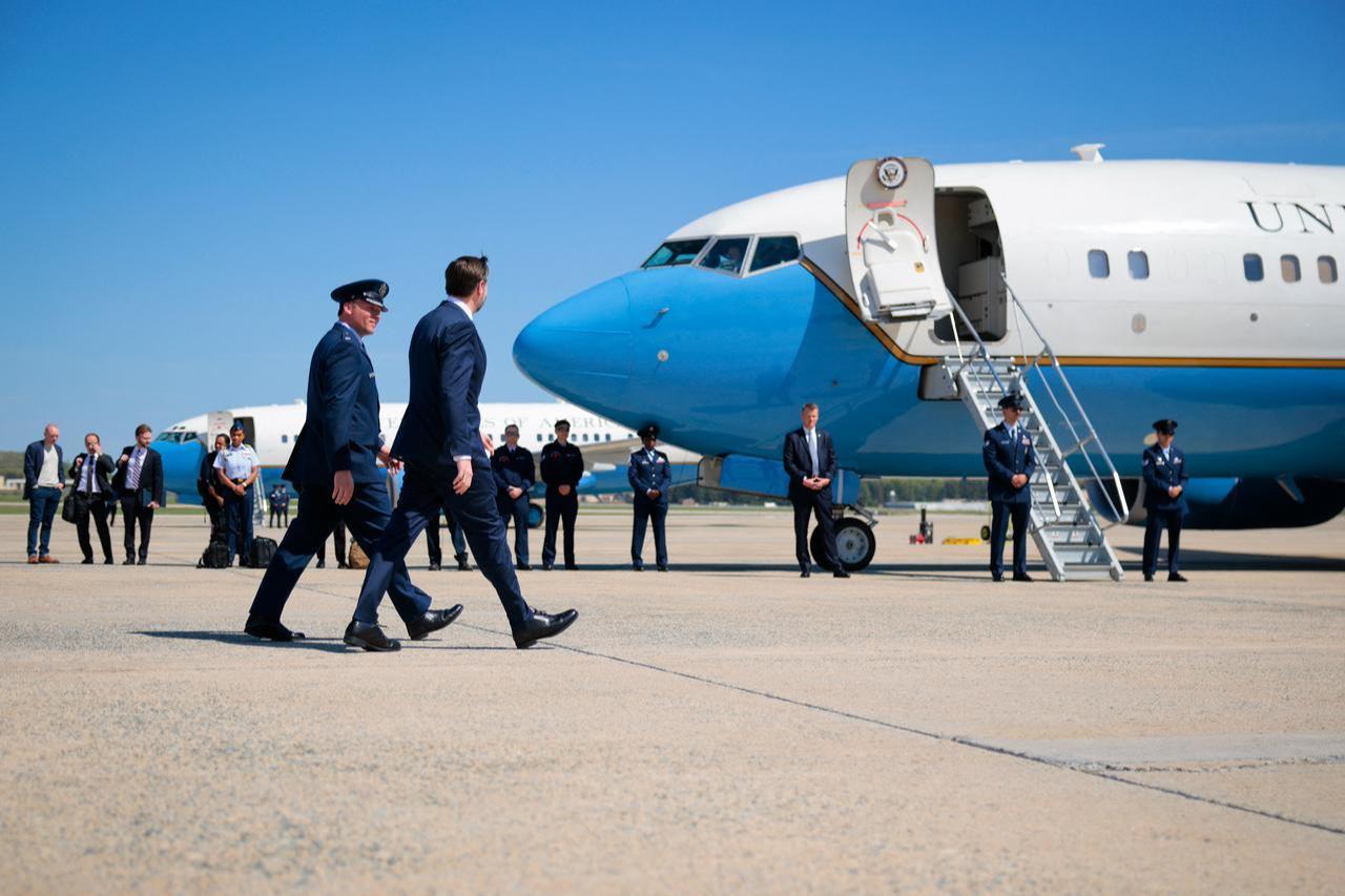 U.S. Vice President JD Vance (R) walks on the tarmac before departing on Air Force Two on April 14, 2026, at Joint Base Andrews, Maryland. (AFP Photo)