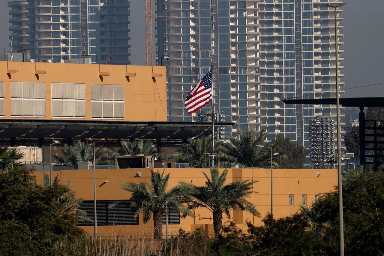 The US flag flutters outside the US Embassy, seen across the Tigris River in Baghdad's fortified Green Zone on March 17, 2026. (AFP Photo)