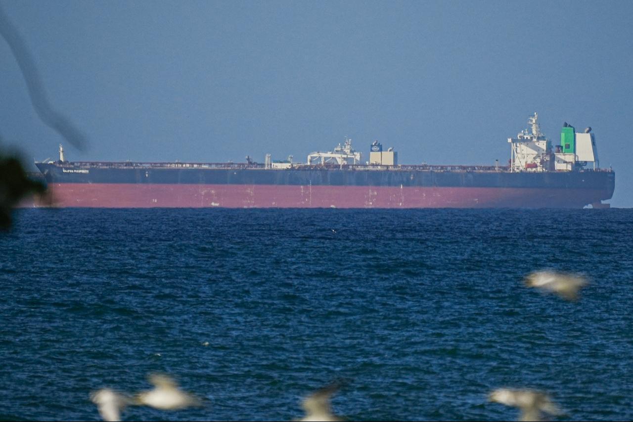 A ship waits to pass through the Strait of Hormuz following the two-week temporary ceasefire between the US and Iran in Oman on April 8, 2026. (AA Photo)