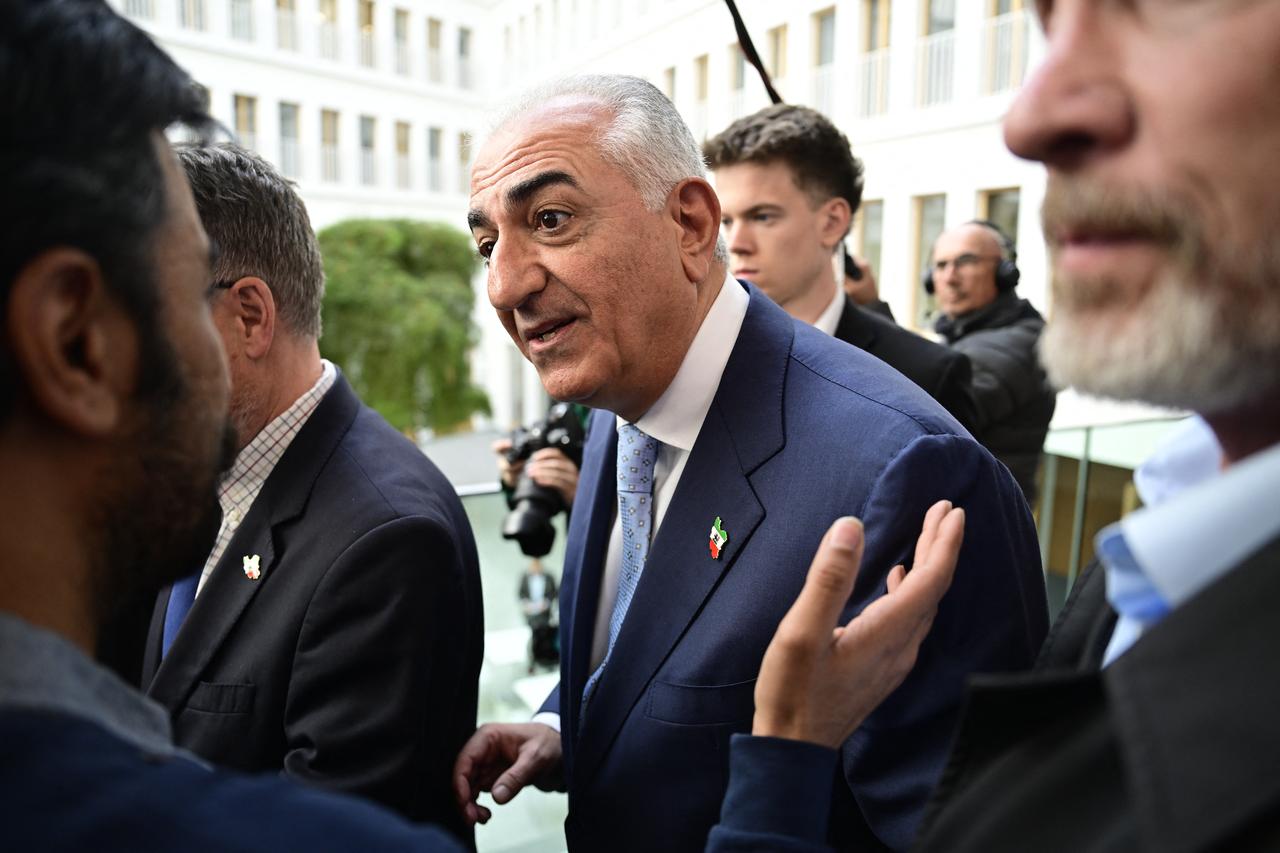 The son of Iran's last shah, exiled Crown Prince Reza Pahlavi speaks to a supporter as he leaves a press conference in Berlin, April 23, 2026. (AFP Photo)