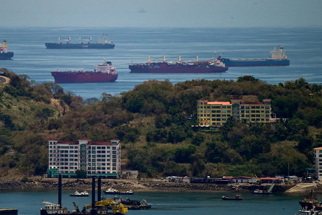 Cargo ships wait to go through the Panama Canal in Panama City on April 21, 2026. (AFP Photo)