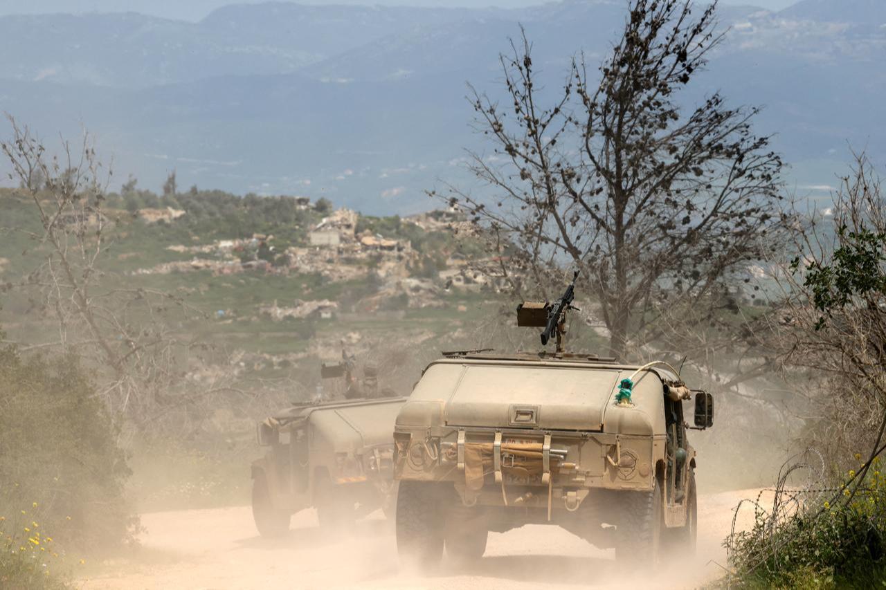 Israeli army soldiers patrol in their Humvees along the border with southern Lebanon, in the Upper Galilee of northern Israel, April 17, 2026. (AFP Photo)