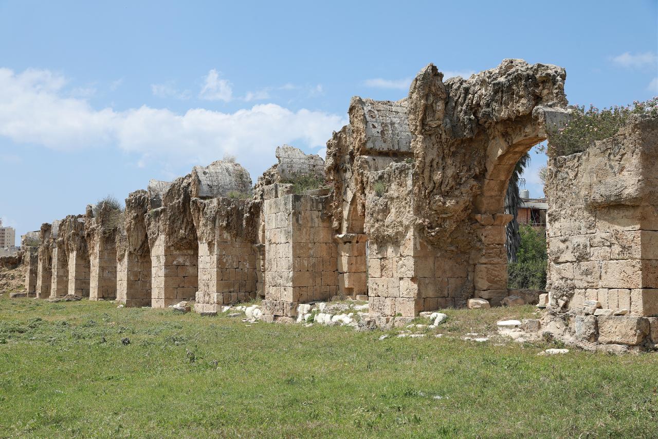 Sections of ancient colonnades at the Al-Bass archaeological area in Tyre show visible wear as nearby buildings were targeted in Israeli strikes, April 24, 2026. (AA Photo)
