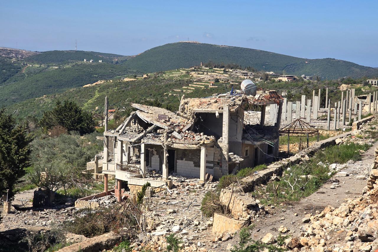 Rubble and debris are strewn along the road at the site of a home destroyed by the Israeli army in the southern Lebanese village of Beit Lif, in the Bint Jbeil district, April 22, 2026. (AFP Photo)