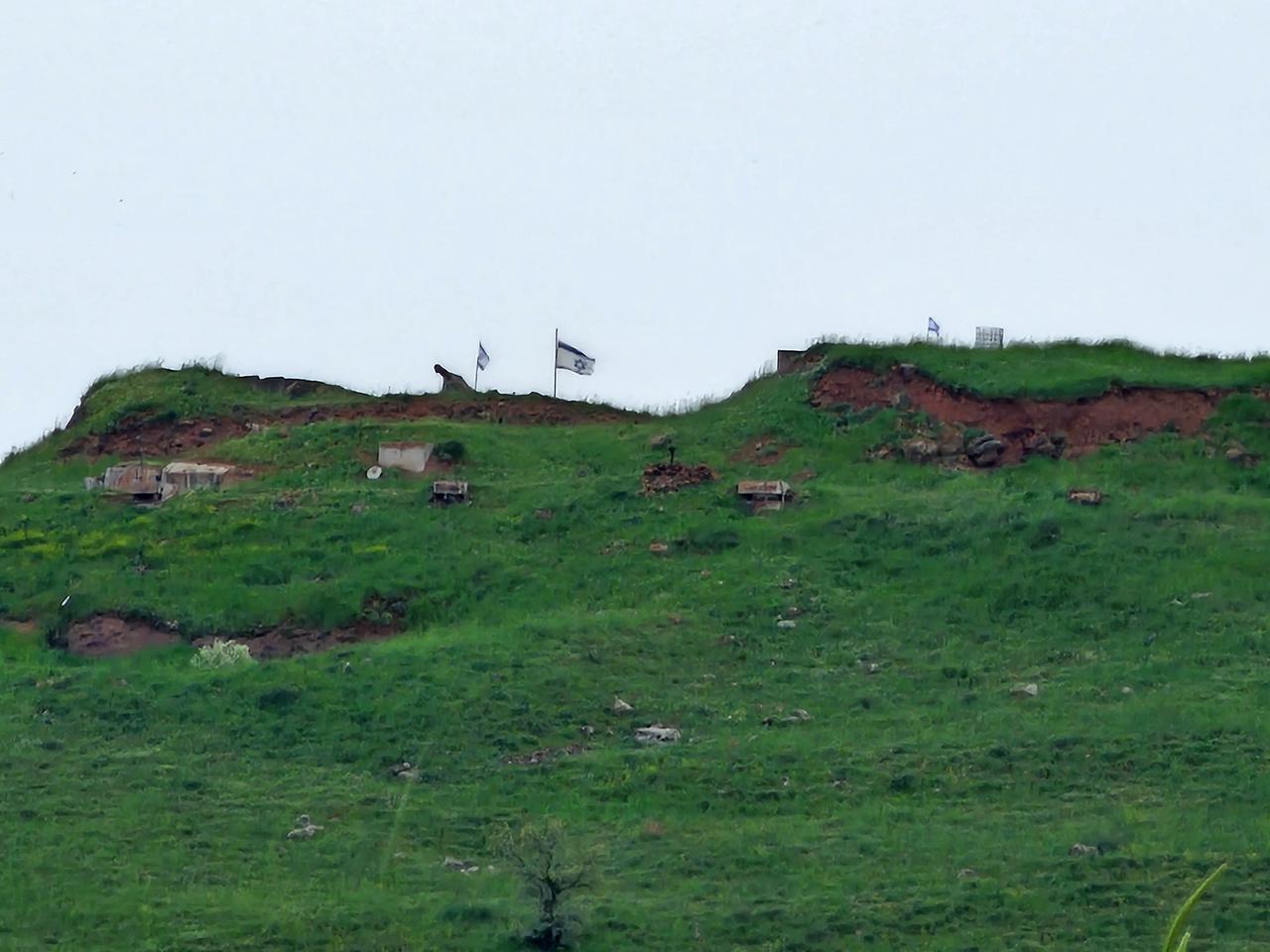 A view of the Israeli flag raised by Israeli forces at the military base they constructed in the Tal al-Ahmar area, located on a hill in the Quneitra, Syria, April 17, 2026. (AA Photo)