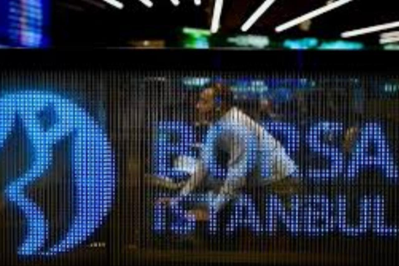 A trader is seen behind an illuminated Borsa Istanbul display panel at the stock exchange’s trading floor in Istanbul, Türkiye. (AA Photo)