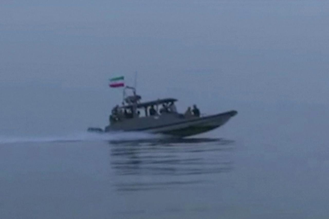 This screen grab, taken from undated video footage released by Iran's Revolutionary Guards (IRGC) on April 23, 2026, shows IRGC naval forces boarding a ship attempting to cross the Strait of Hormuz. (Photo by IRIB TV/AFP)