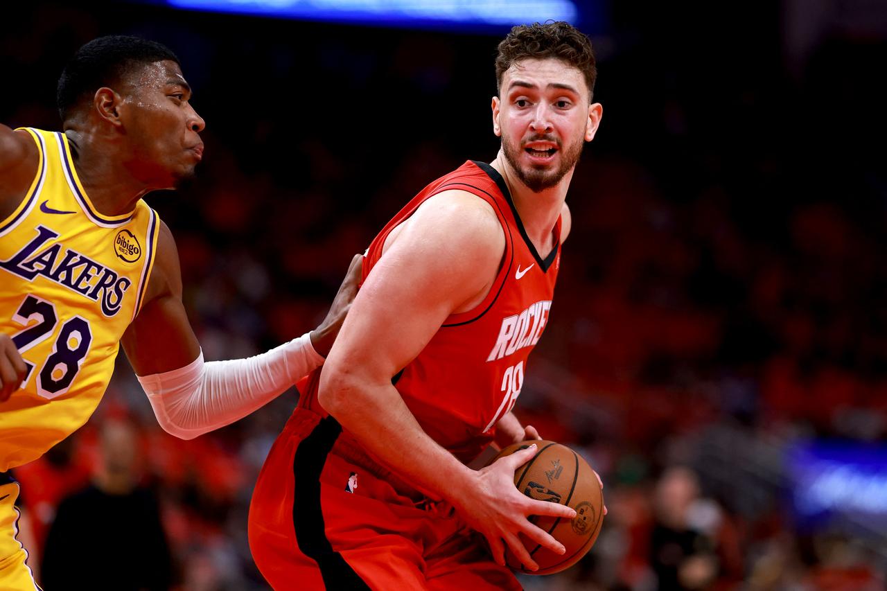 Alperen Sengun #28 of the Houston Rockets backs down Rui Hachimura #28 of the Los Angeles Lakers during the first quarter of the game at Toyota Center in Houston, Texas, April 24, 2026.  (AFP Photo)