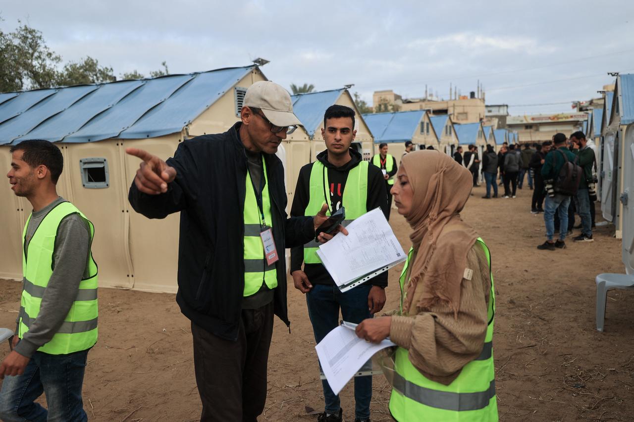 Palestinian electoral officials prepare makeshift polling stations in tents for municipal elections in Deir el-Balah, Gaza Strip, on April 25, 2026. (AFP Photo)