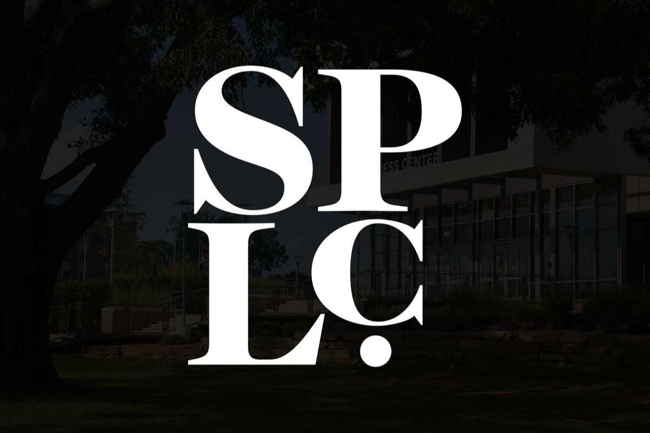 This image features the monogram for the Southern Poverty Law Center (SPLC), a non-profit organization focused on civil rights and public interest law.