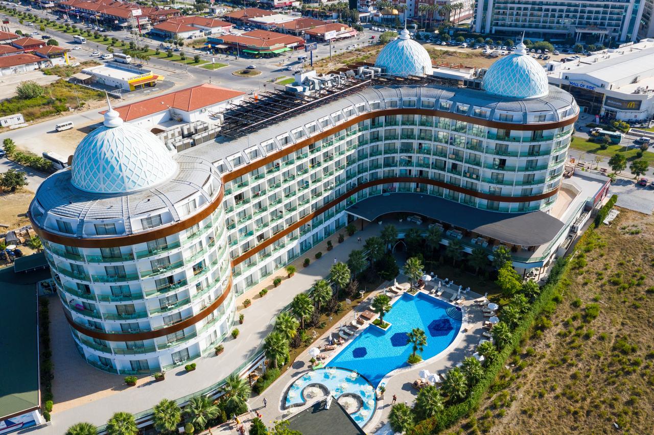 An aerial drone view shows the Side Crown Sunshine Hotel and its pool area in the Side district of Antalya, Turkiye, October 4, 2020. (Adobe Stock Photo)