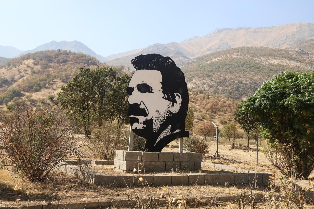 This photograph shows a cutout portrait of the jailed ringleader of the terrorist organization PKK, Abdullah Ocalan, during a ceremony in the Qandil area of northern Iraq, October 26, 2025. (AFP Photo)