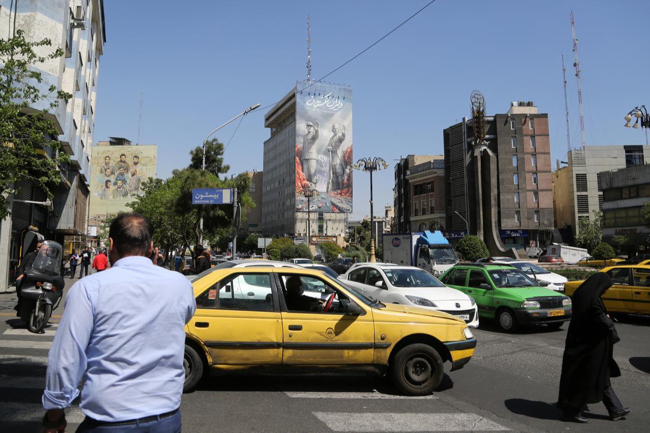 A giant banner depicting the Strait of Hormuz is displayed at Fatemi Square, April 15, 2026, in Tehran, Iran. (AA Photo)