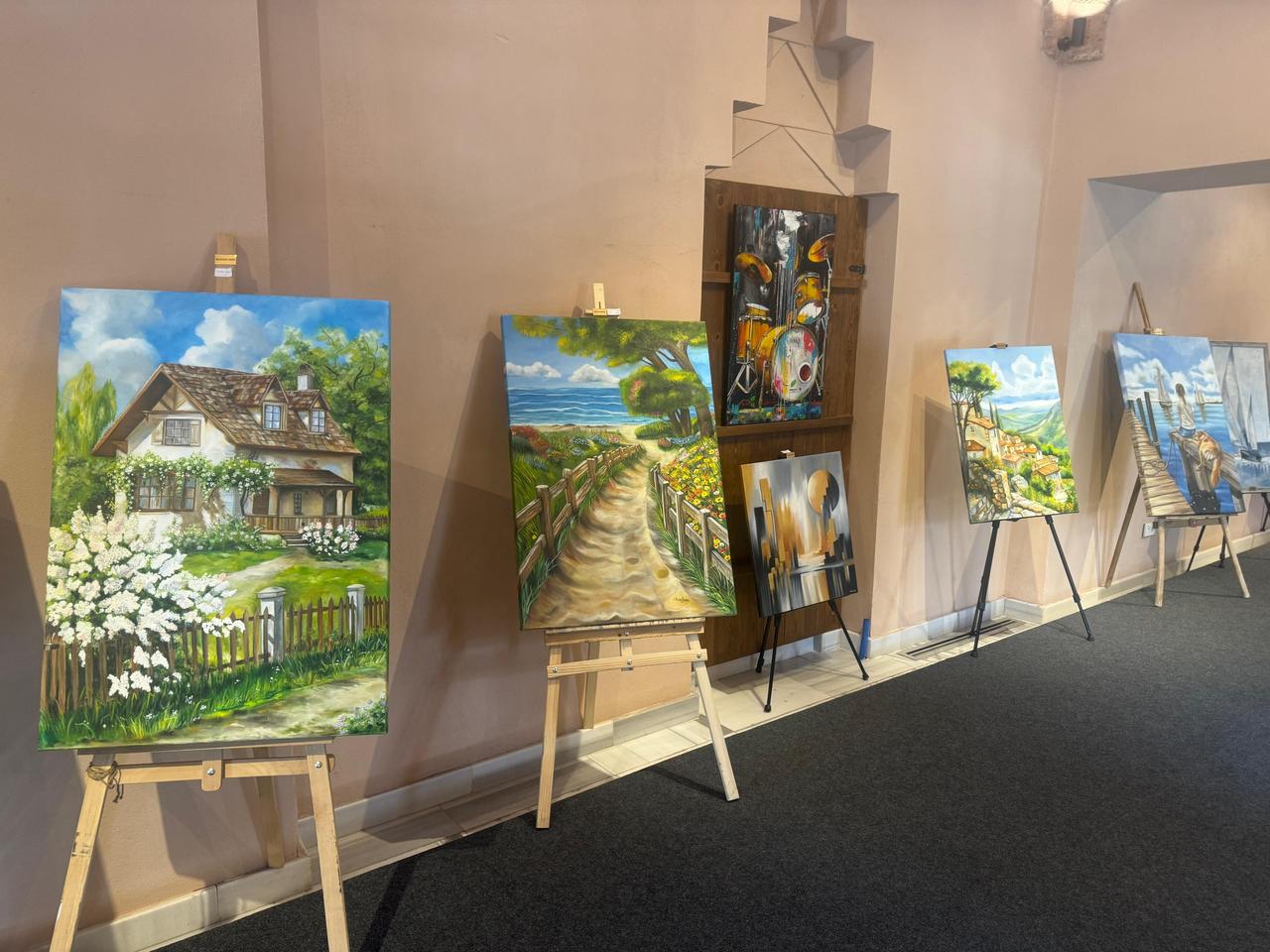 Paintings are displayed during the “Between Fantasy and Reality” exhibition at Uskudar Mimar Sinan Exhibition Hall in Istanbul, Türkiye, April 14, 2026. (AA Photo)