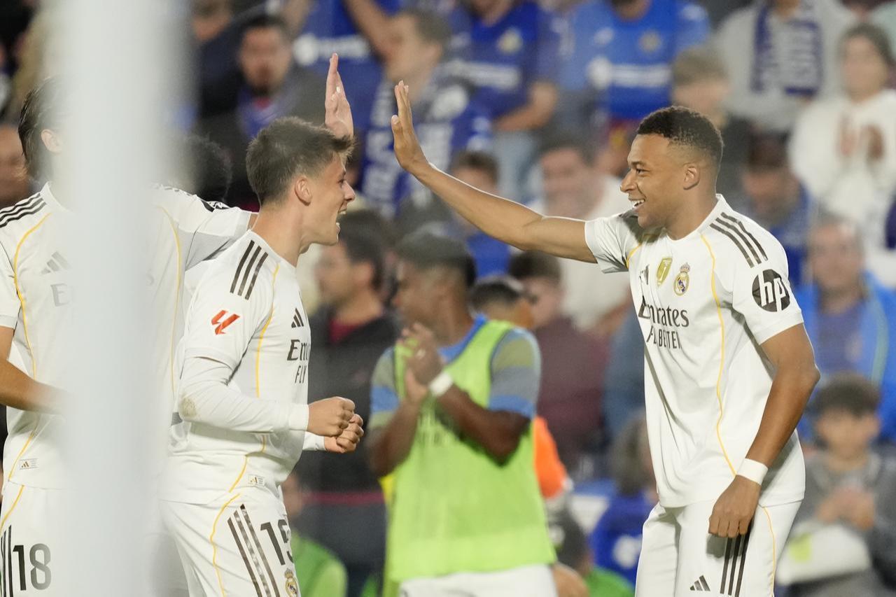 Kylian Mbappe, forward for Real Madrid and France, celebrating a goal with teammates Arda Guler and Alvaro Carreras during the LaLiga EA Sports match between Getafe CF and Real Madrid CF at the Coliseum Alfonso Perez, Getafe, Spain, October 19, 2025. (AA Photo)